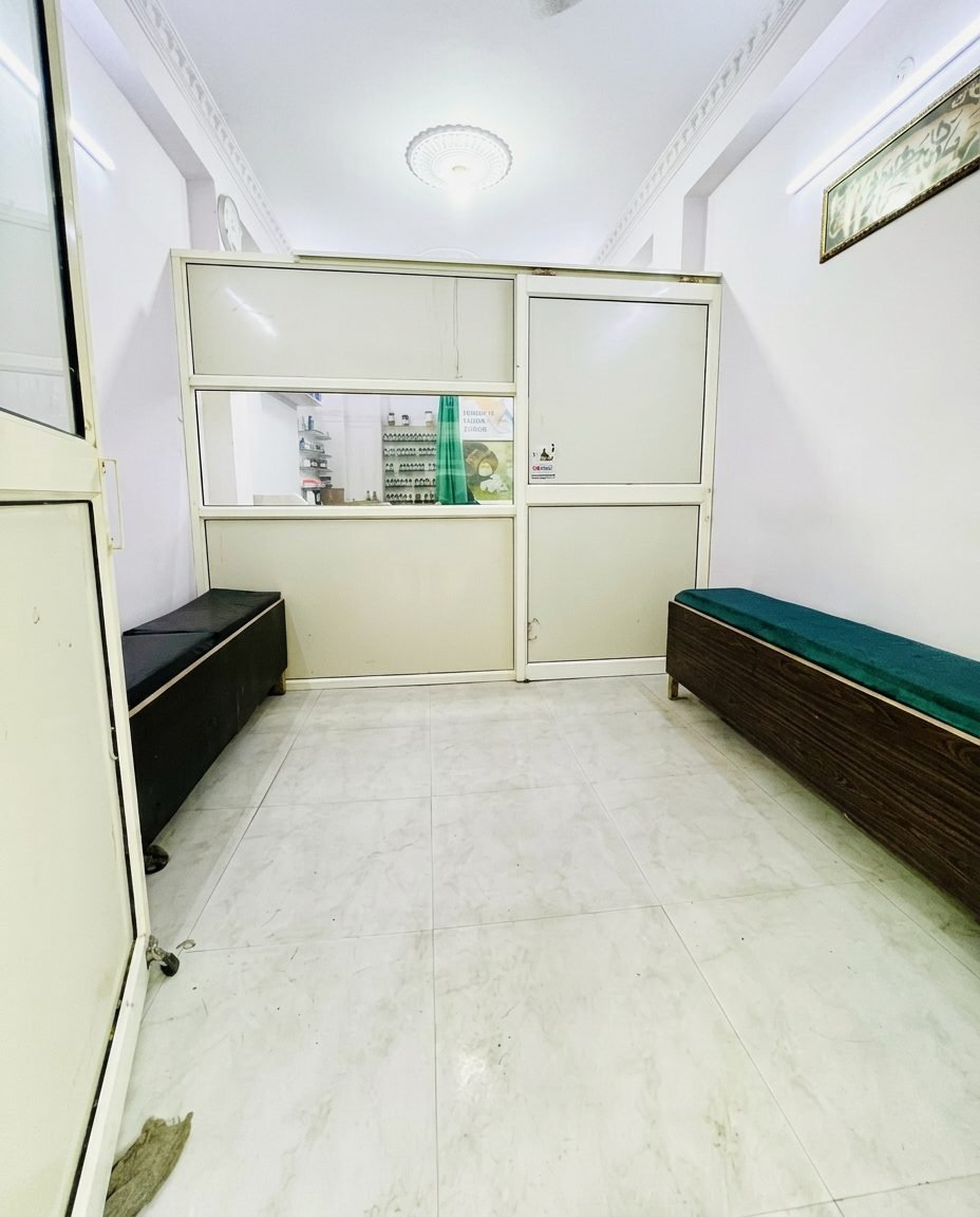 Clean waiting area with cushioned benches at Hashmi Homeopathic Clinic, Jaitpur